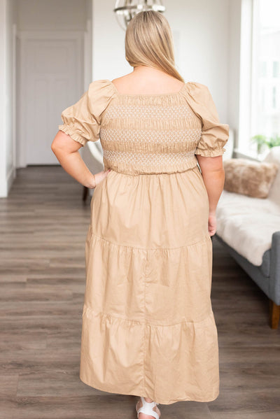 Back view of a plus size taupe dress