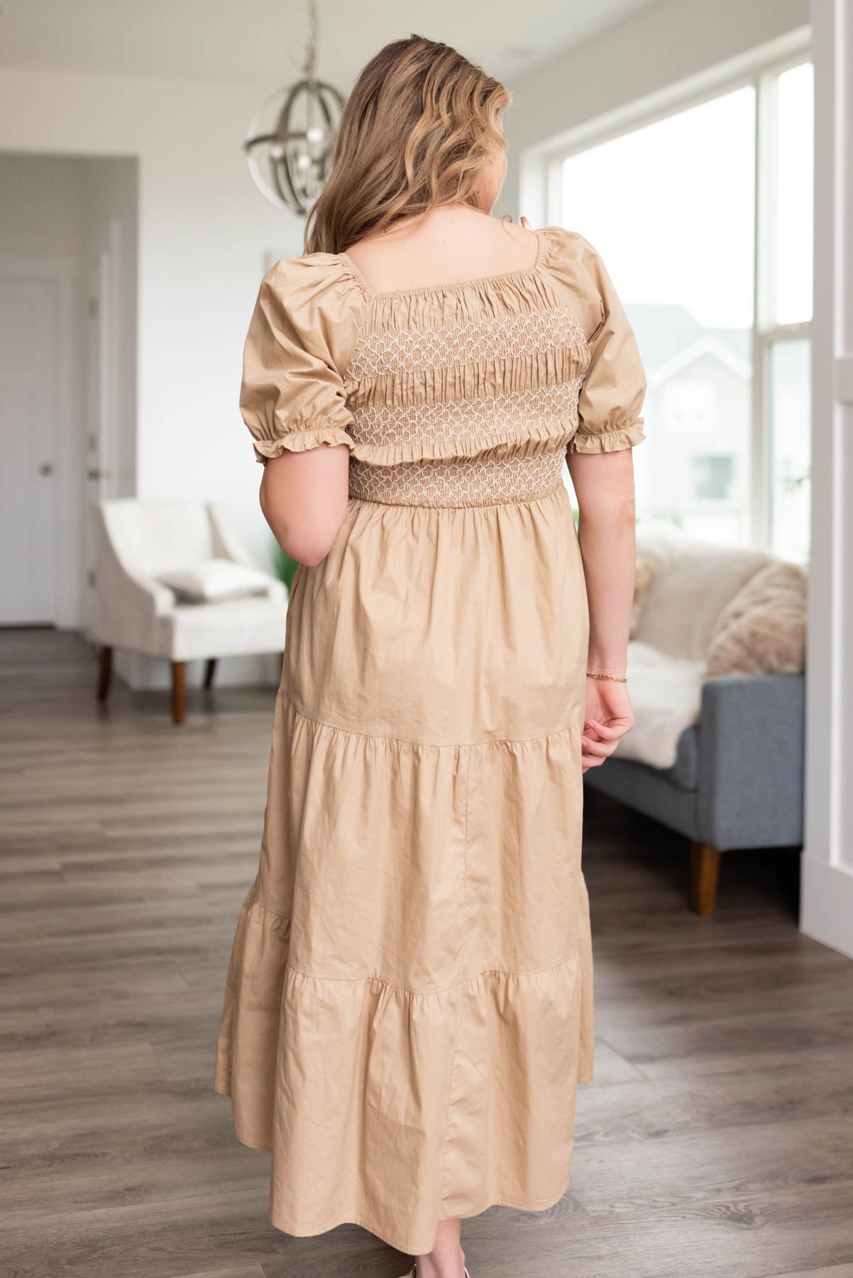 Back view of a taupe dress