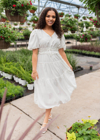 Ivory vneck dress with ruffles at the waist