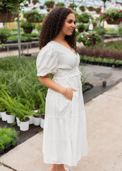 Side view of the ivory vneck dress