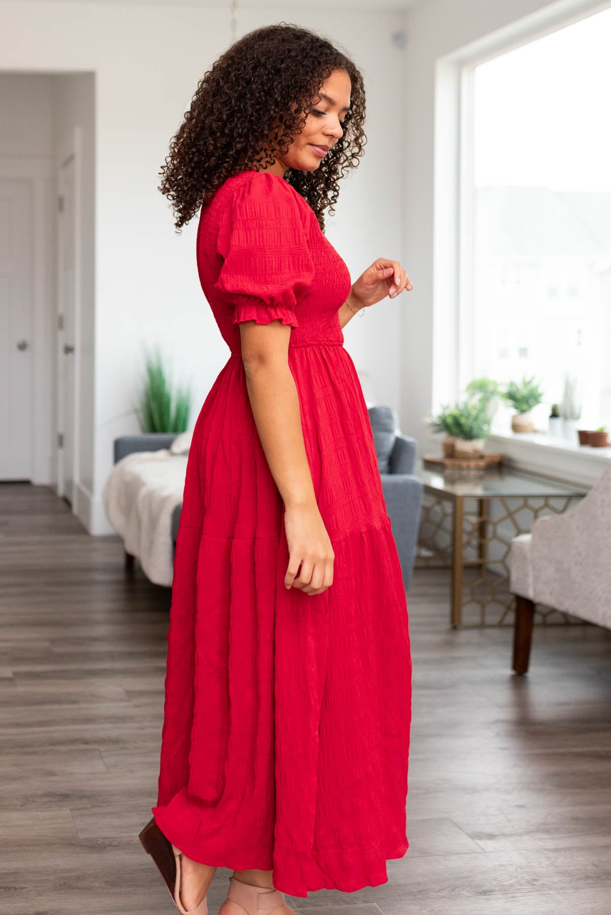 Side view of a red smocked dress