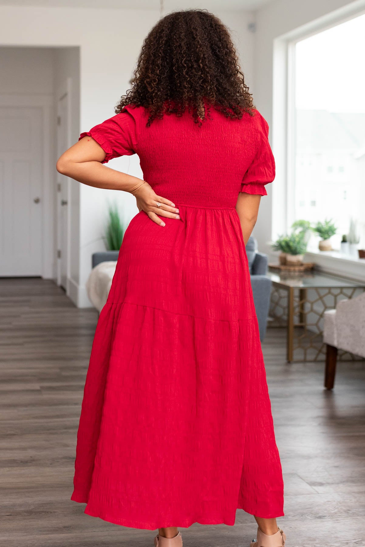 Back view of a red smocked dress