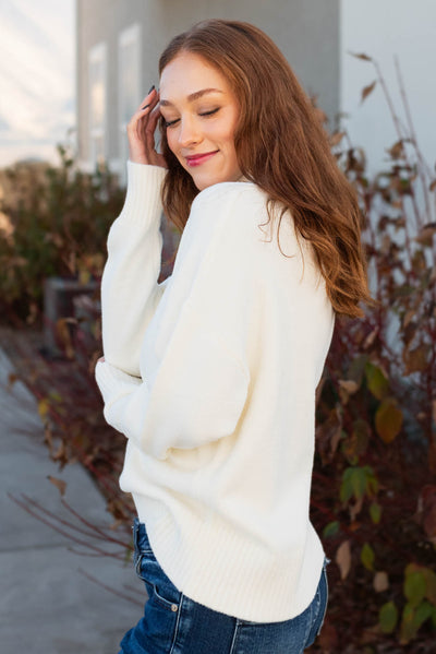 Side view of the ivory sweater