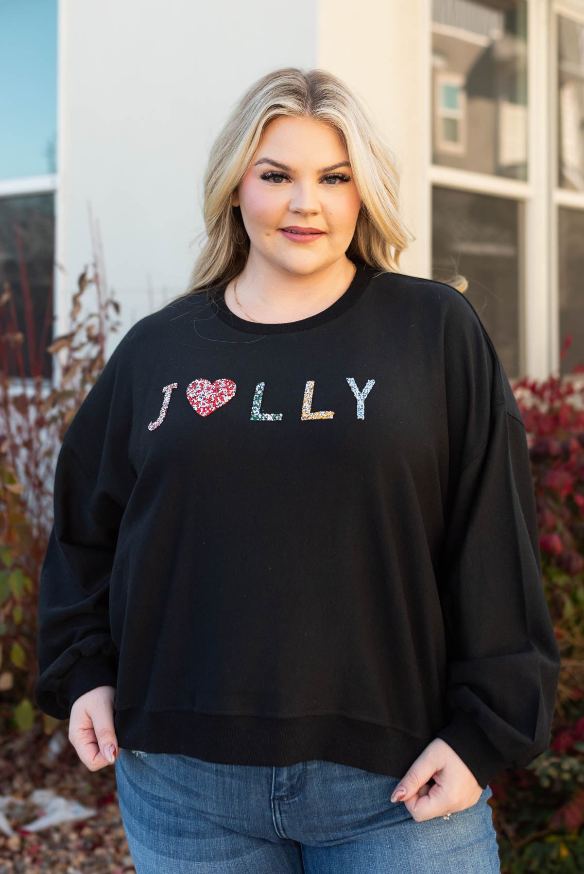 Front view of the jolly rhinestone crewneck with long sleeves