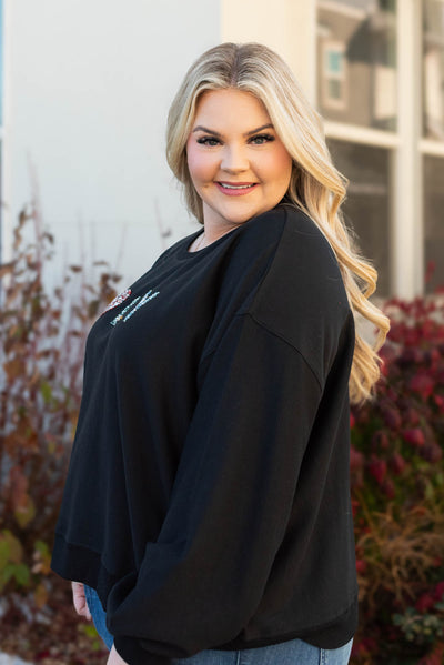 Side view of the plus size jolly rhinestone crewneck