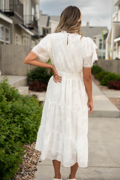 Back view of a white floral dress