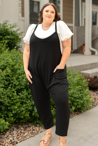 Front view of a black jumpsuit plus size