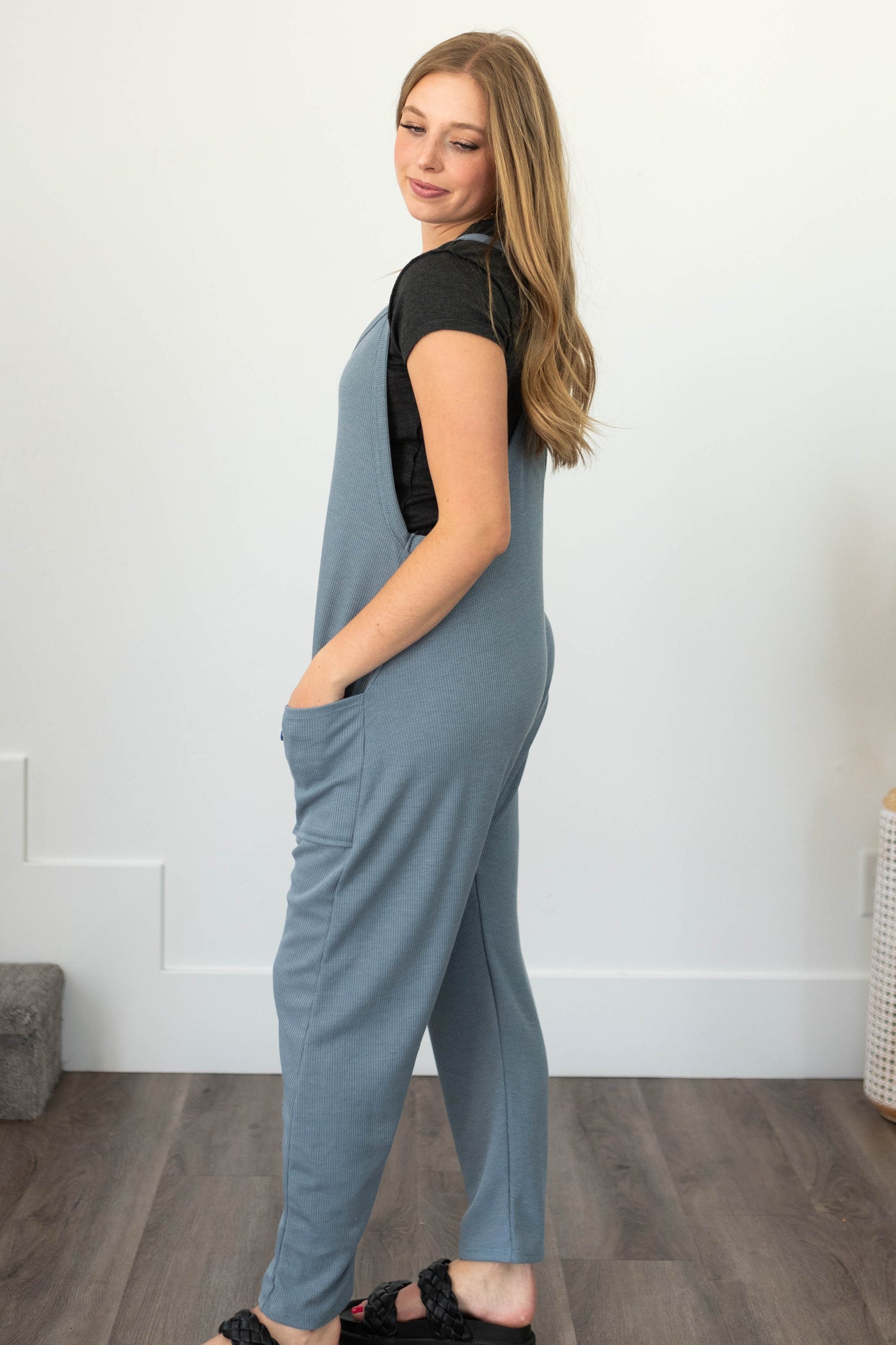 Side view of a chambray jumpsuit