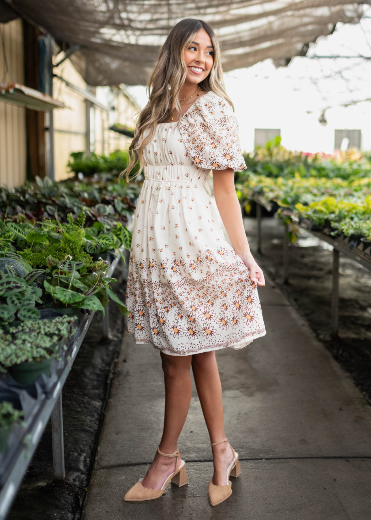 Side view of the beige daisy dress