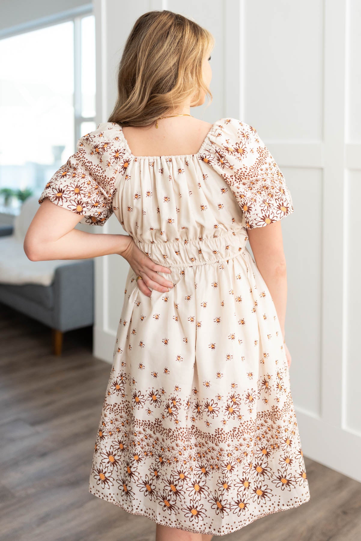 Back view of the beige daisy dress