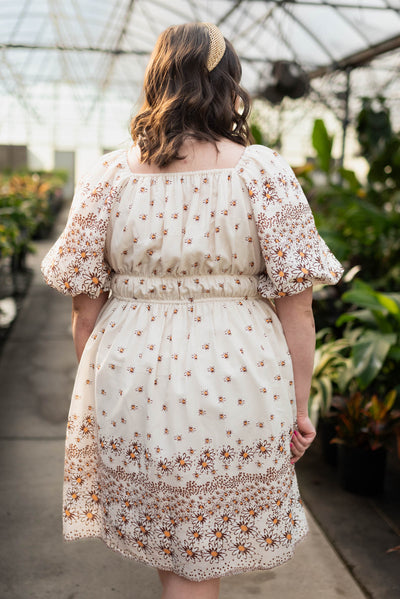 Back view of the plus size beige daisy dress