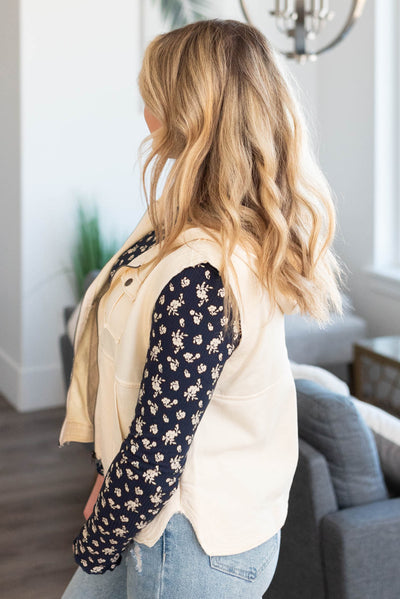 Side view of a cream vest