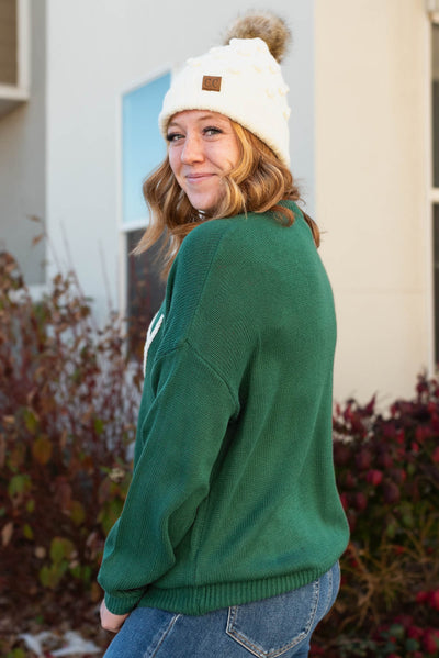 Side view of joy hunter green sweater