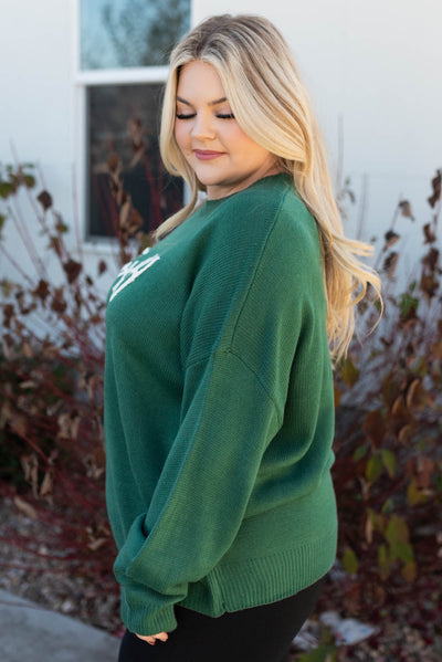 Side view of the plus size hunter green sweater