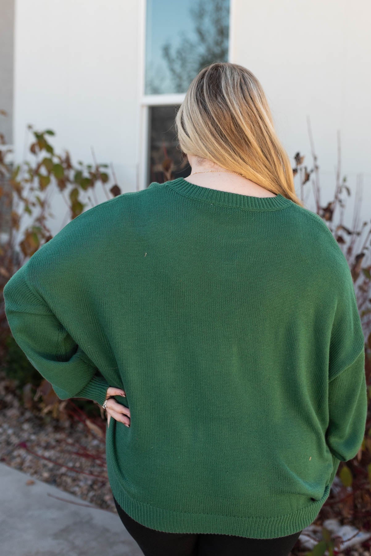 Back view of the plus size joy hunter green sweater