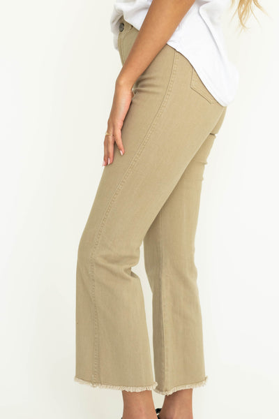 Side view of Tan straight leg, frayed edge, ankle length pants