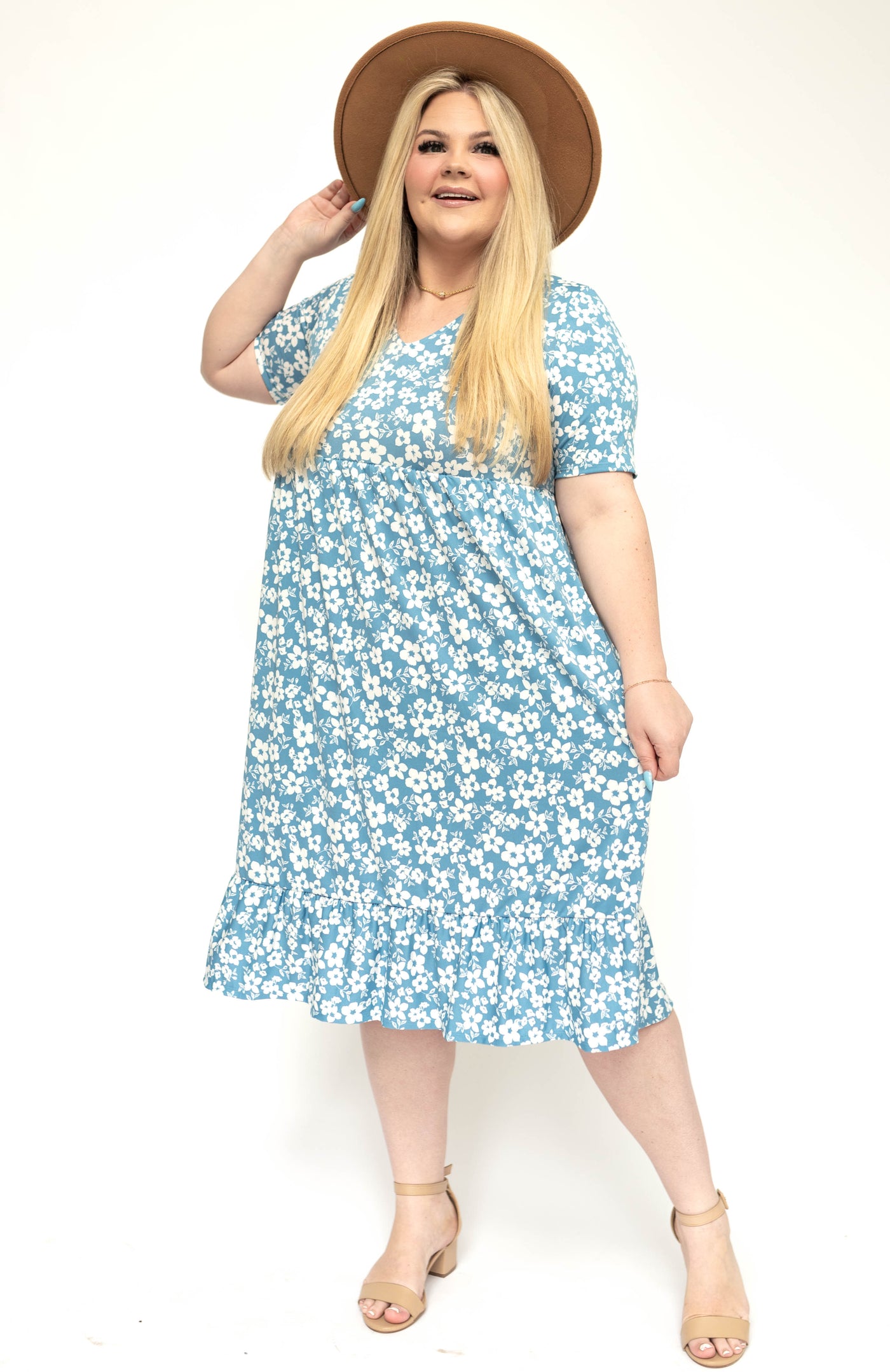 Plus size blue floral top with ruffle at the bottom