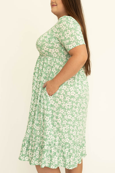Side view of a plus size mint floral dress