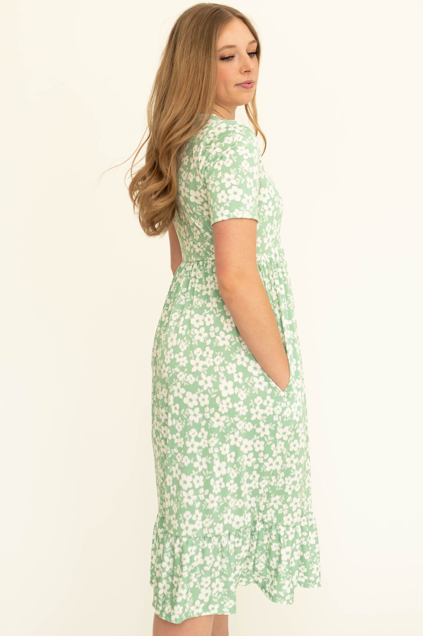Side view of a mint floral dress