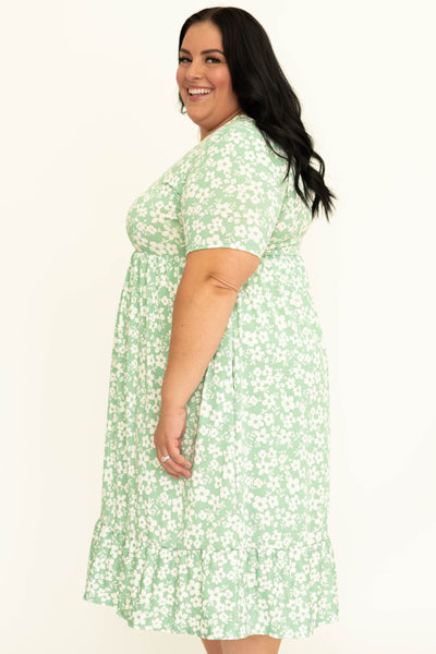 Side view of a plus size mint floral dress