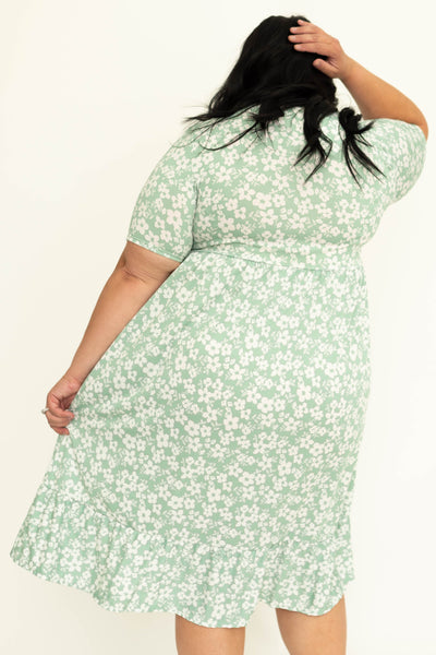 Back of a plus size mint floral dress