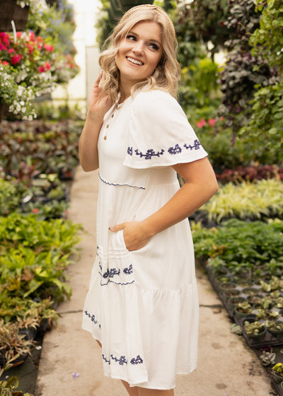 Short sleeve white dress with blue embroidery on the front
