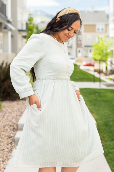Side view of a sage green dress