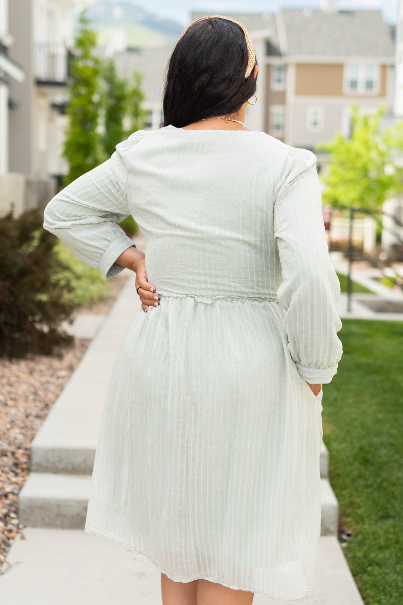 Back view of a sage green dress