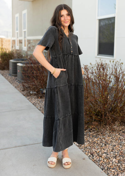 Black cotton dress with pockets and buttons onthe bodice