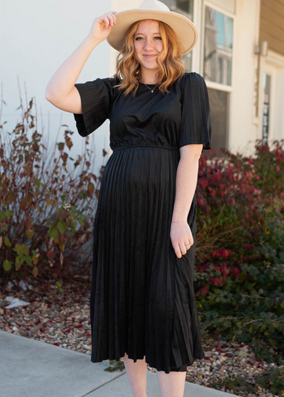 Front view of the black pleated dress