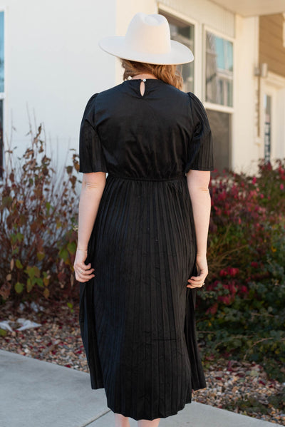 Back view of the black pleated dress