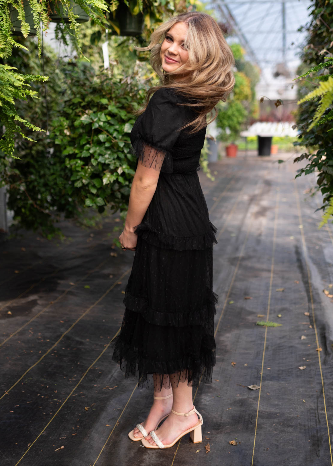 Side view of the black dress with short sleeves