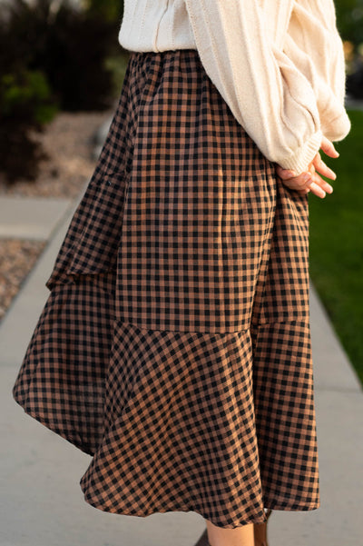 Side view of a mocha plaid skirt