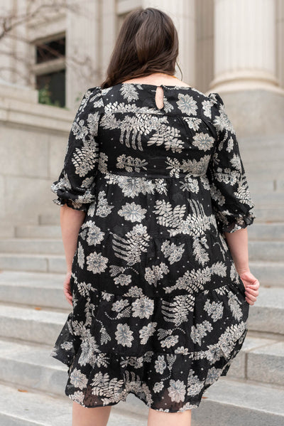 Back view of a black floral dress