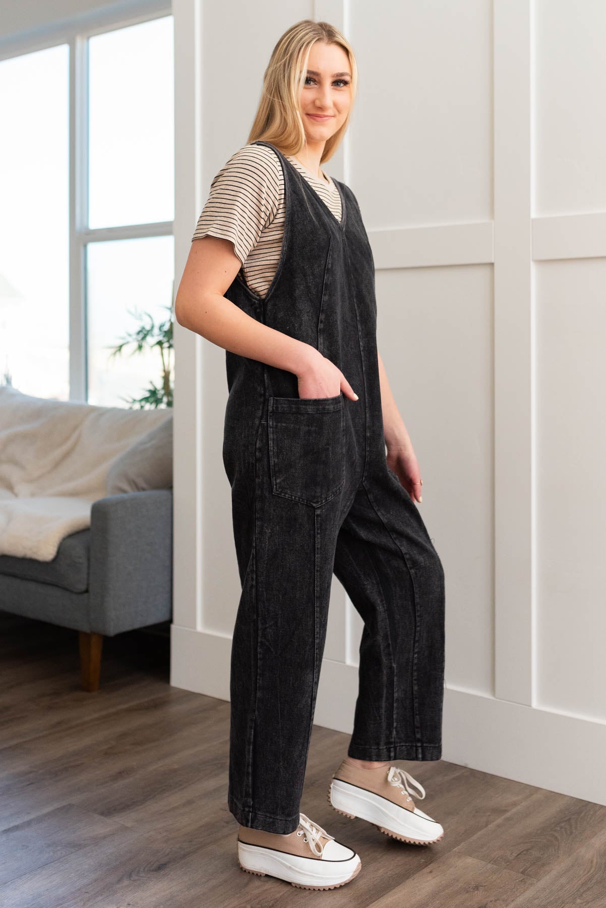 Side view of the black denim overalls