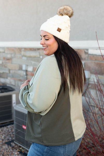 Side view of the olive block sweater