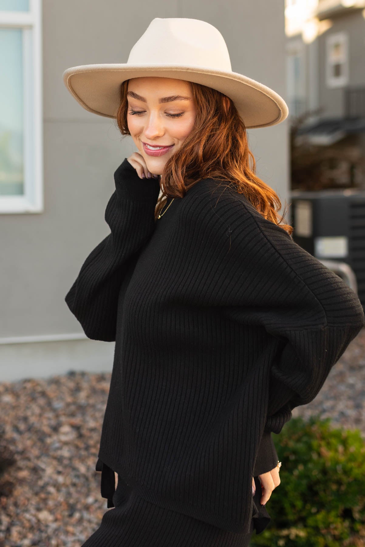 Side view of a black sweater