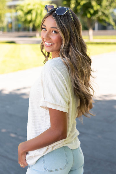 Side view of the ivory textured top