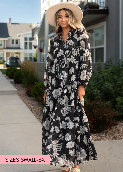Long sleeve black dress with floral print and ties at the neck