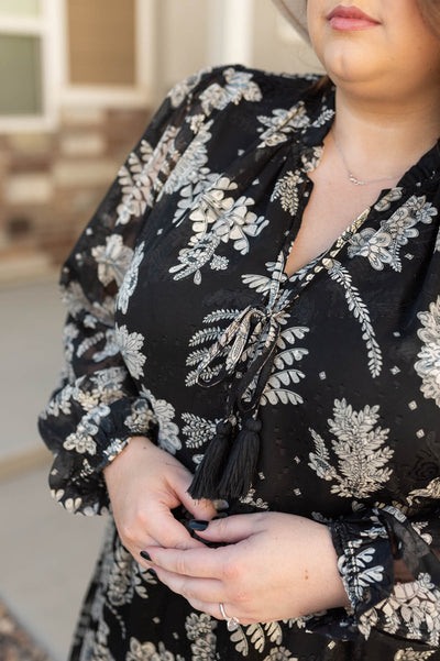 Plus size black dress with ties at the neck