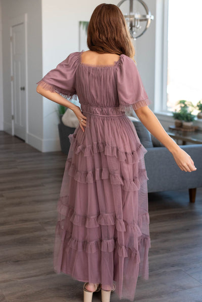 Back view of a dusty lavender maxi dress