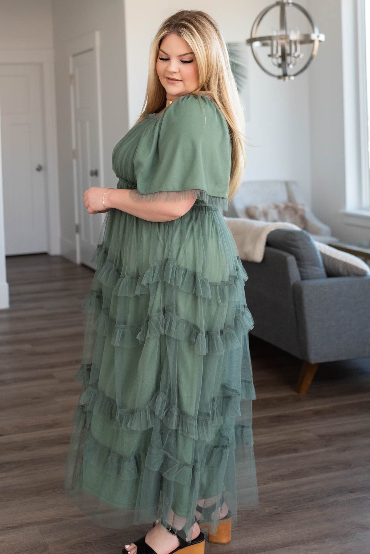 Side view of a plus size dusty teal maxi dress