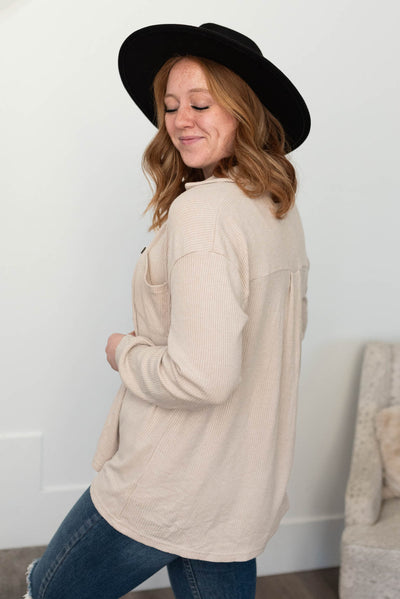 Side view of a taupe top
