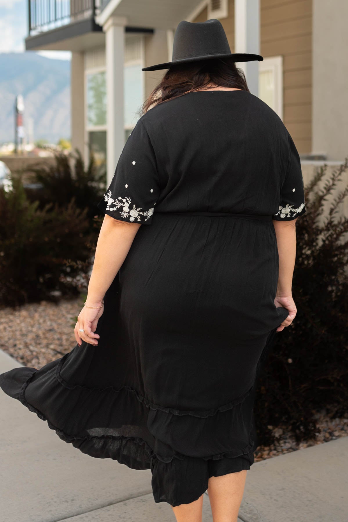 Back view of a plus size floral dress