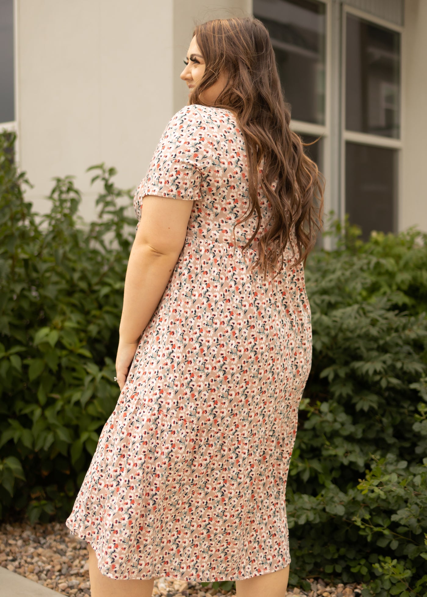 Side view of a mocha floral dress