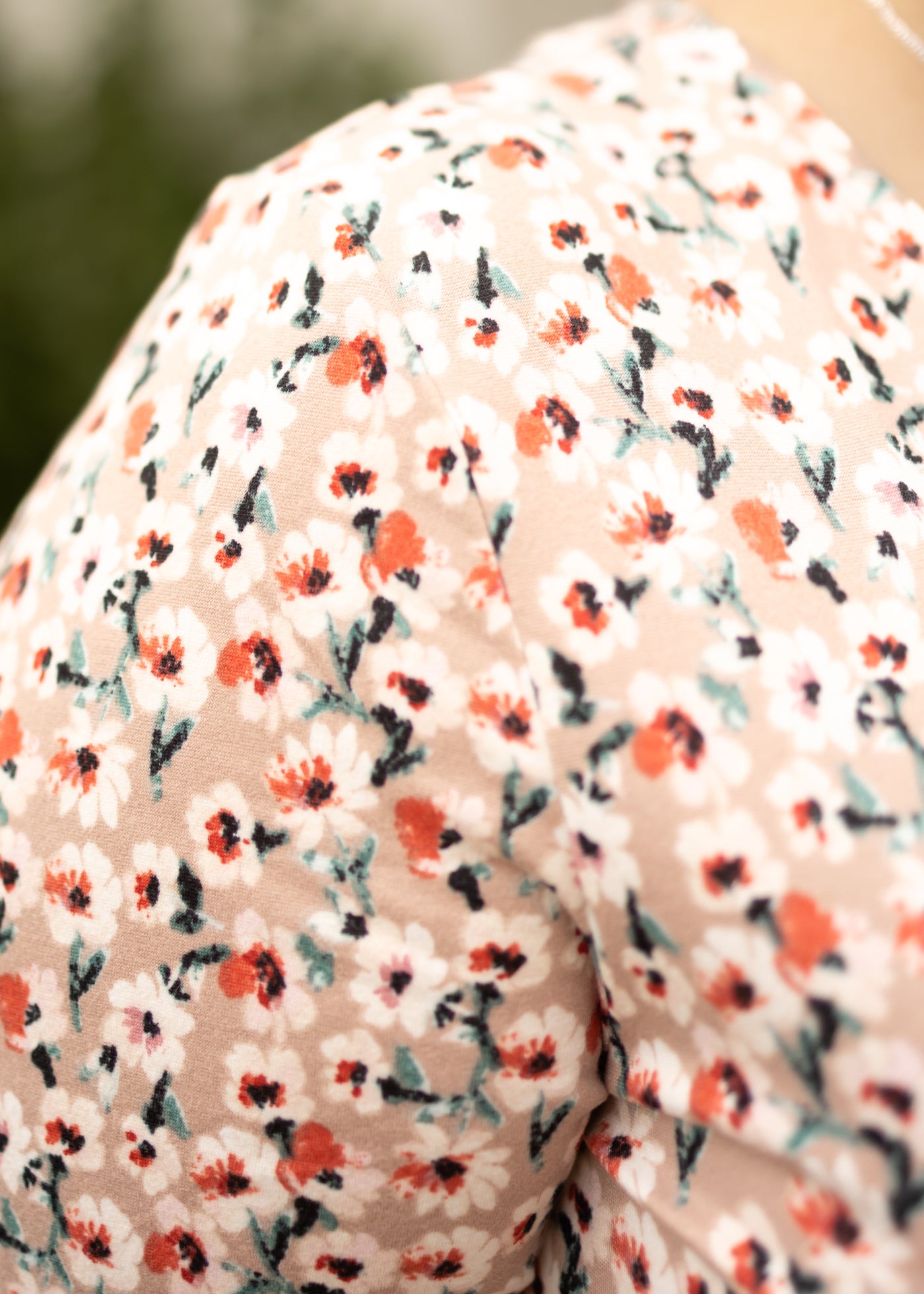 Fabric view of a plus size mocha floral dress