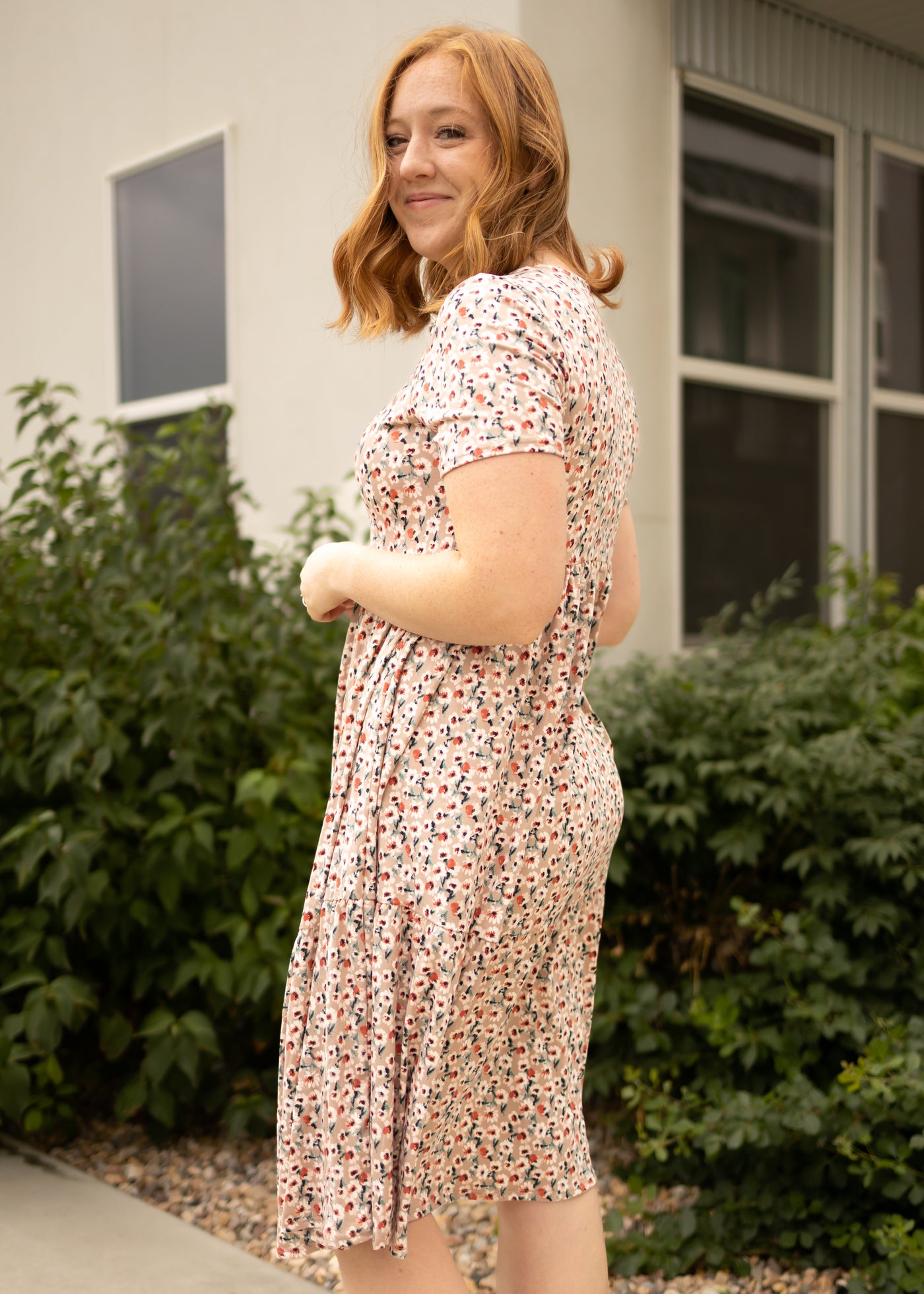 Side view of a mocha floral dress