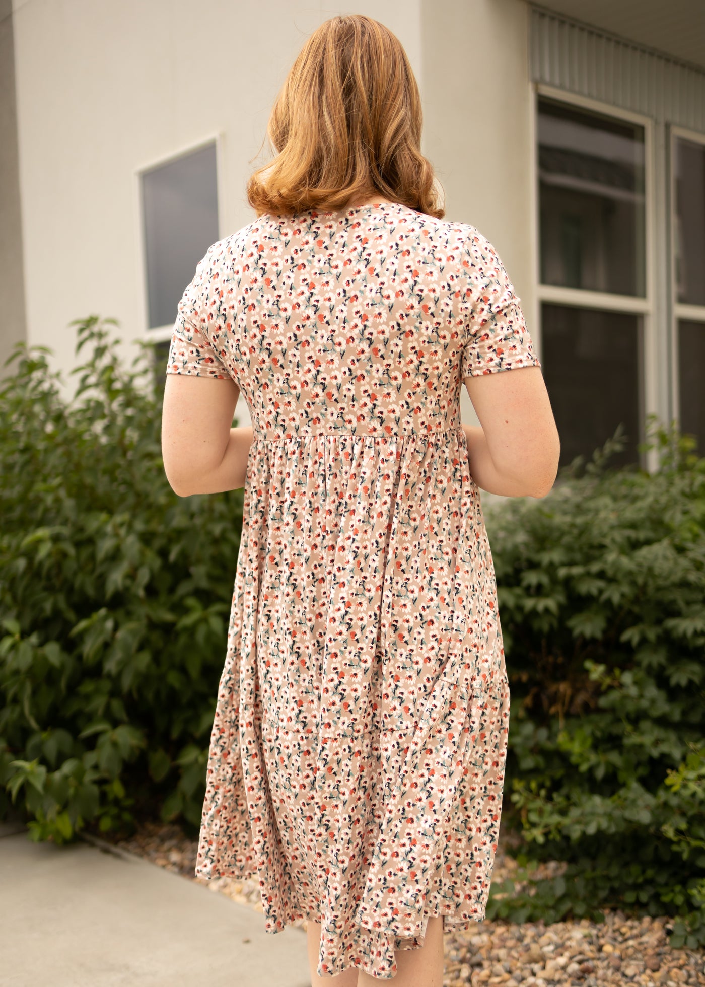 Back view of a mocha floral dress