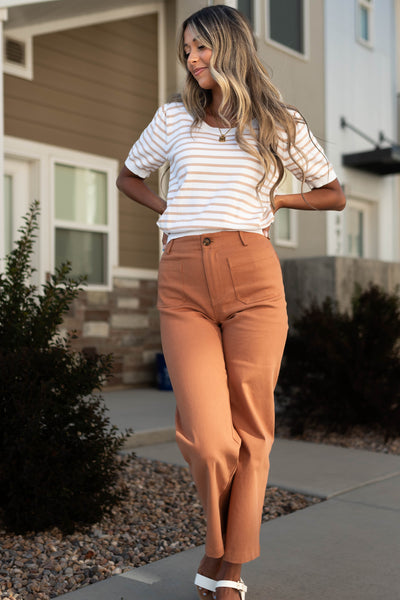 Taupe striped top with caramel pants that are sold separately 