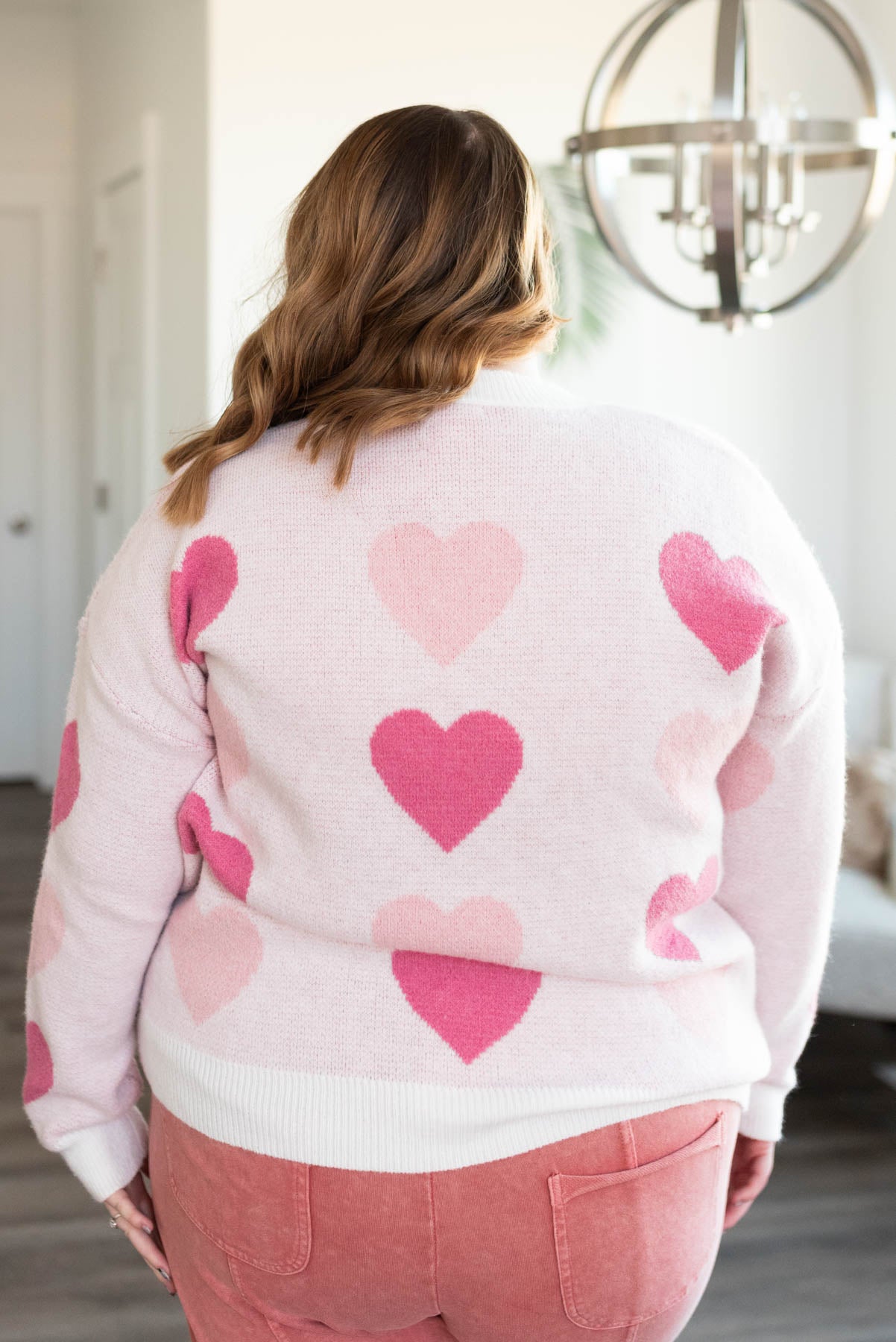 Back view of the plus size pink heart sweater